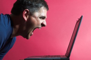 man yelling at computer